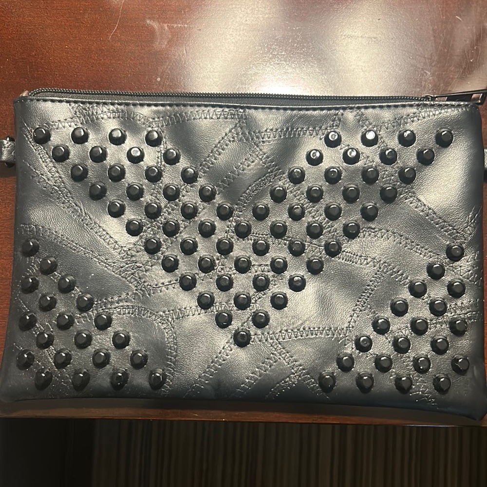 Black studded clutch bag